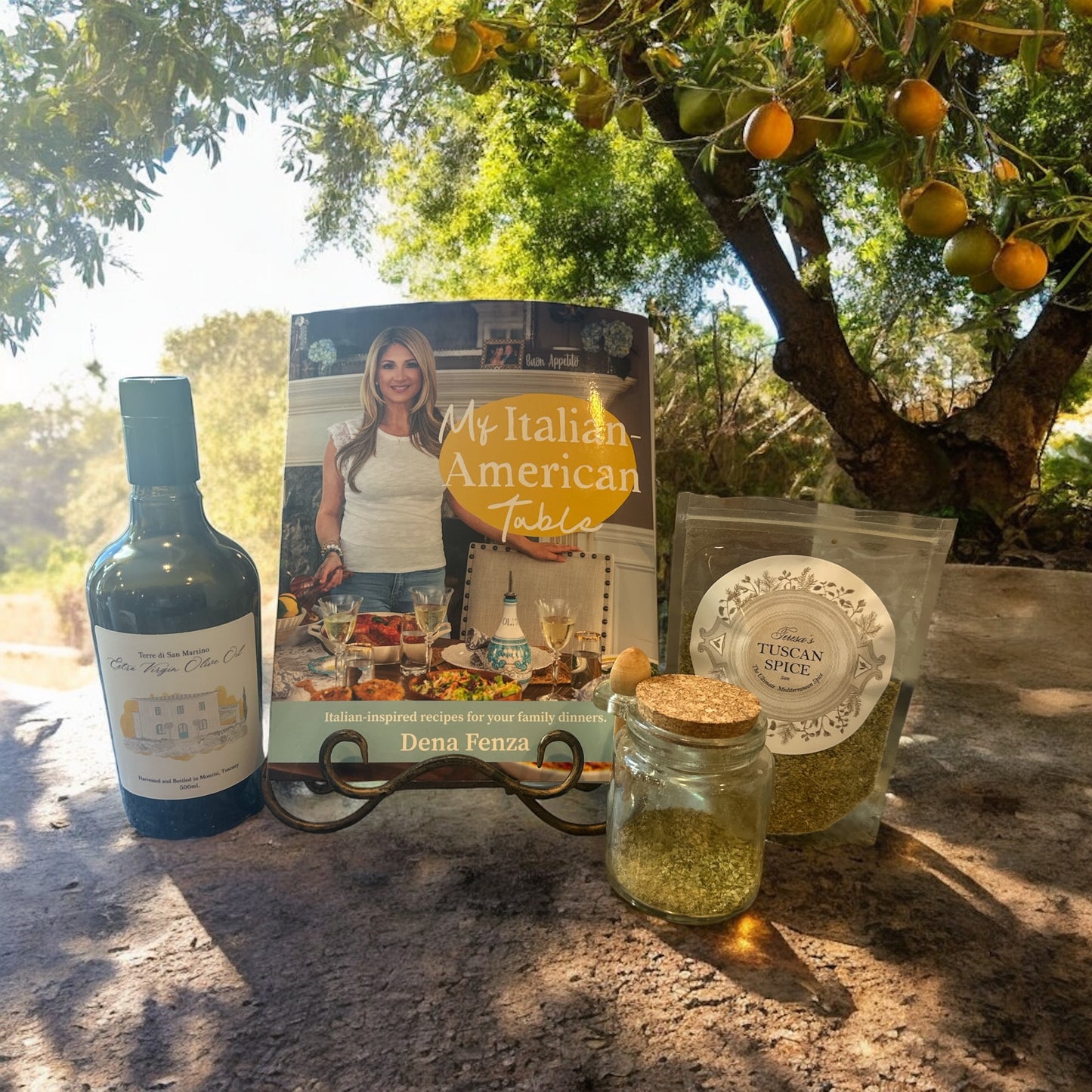 Teresa’s Tuscan Spice Bag (5 oz.) and Decorative Glass Container with Spoon, Il Poderino by San Martino Extra Virgin Olive Oil (500 ML) & a copy of the cookbook entitled My Italian American Table by Dena Fenza